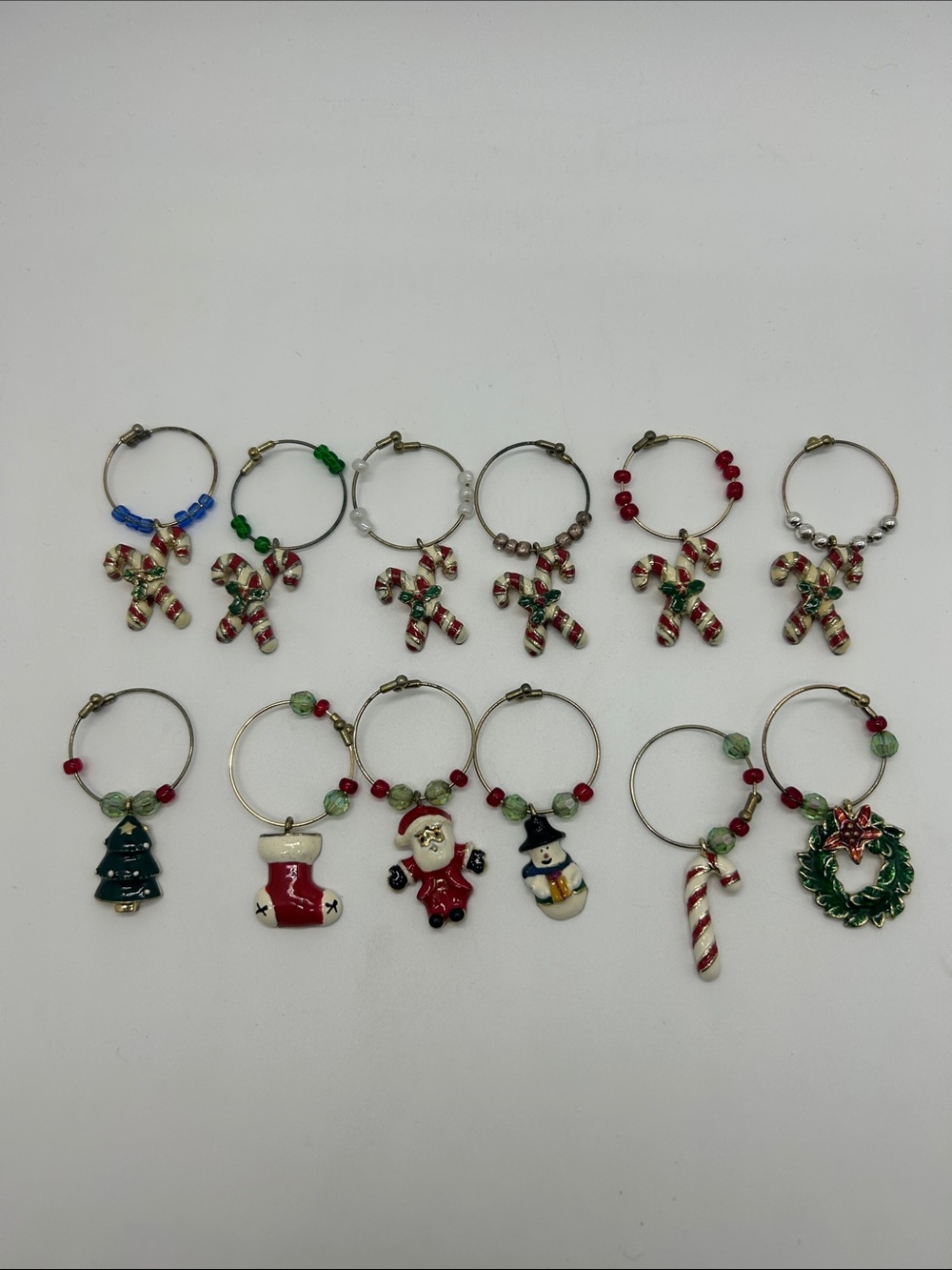 🎄12 Christmas Holiday wine charms Candy Cane Snowman Santa Claus Stocking wreath